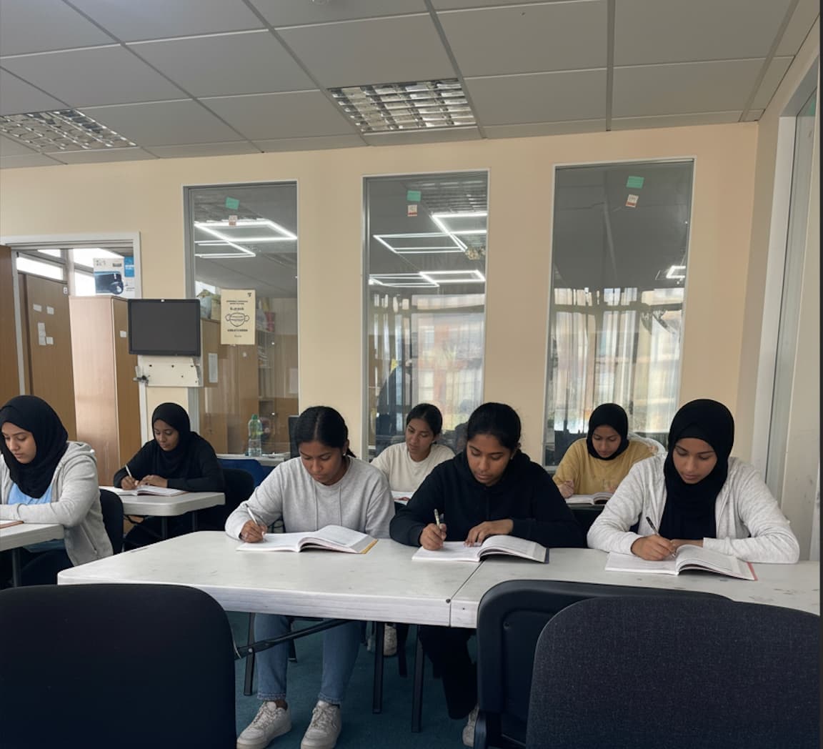 Girls studying together in bright learning environment